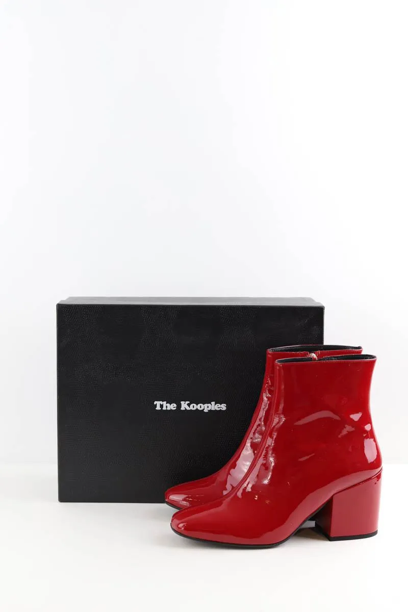 Boots en cuir verni The Kooples bordeaux. Matière principale cuir verni. Taille 39.